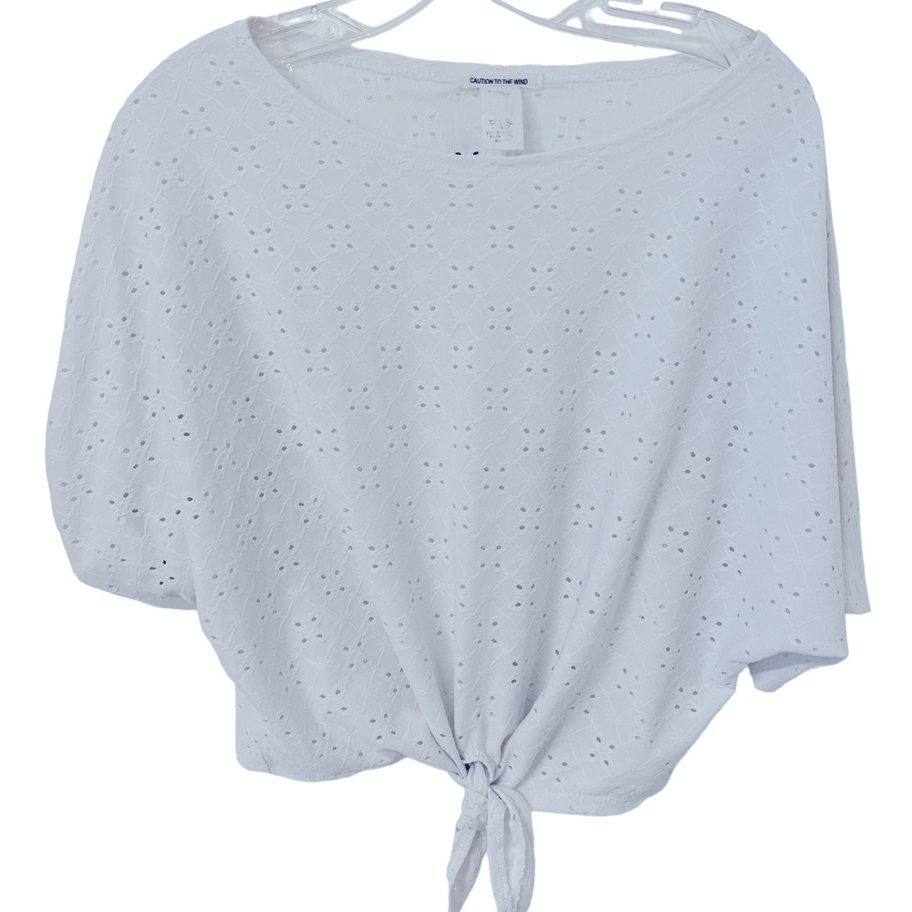Caution to the Wind eyelet summer top. Says size small but will fit a medium.
